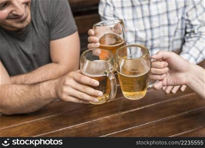 crop men celebrating pub