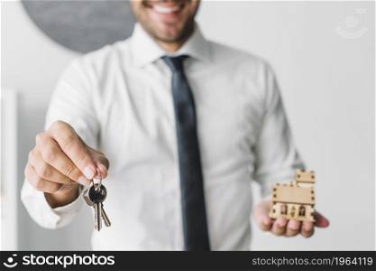 crop real estate agent with keys house. High resolution photo. crop real estate agent with keys house. High quality photo