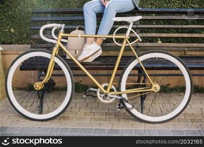 crop woman sitting bench bicycle