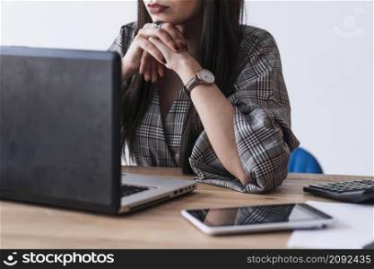 crop woman using laptop thinking