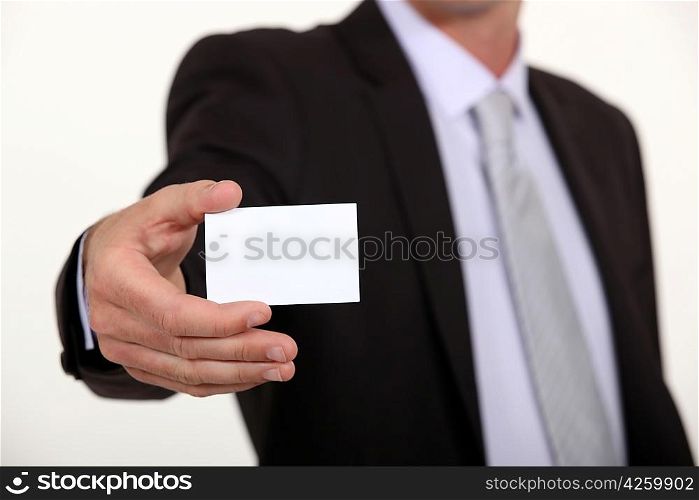 Cropped executive with a blank businesscard