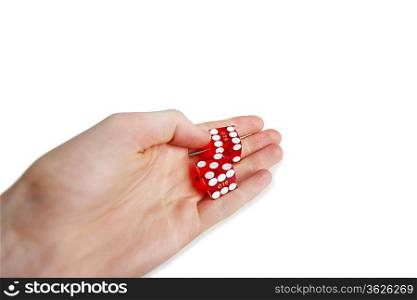 Cropped image of hands holding gambling cubes over white background