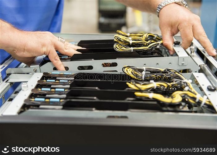 Cropped image of male technician examining computer card slots in electronics industry