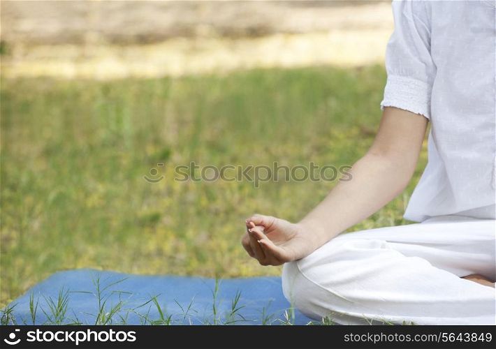Cropped image of woman practicing yoga