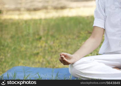 Cropped image of woman practicing yoga