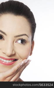 Cropped image of young woman with hand on chin