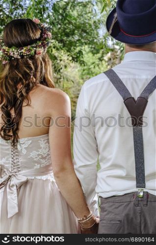 Cropped photo of a beautiful couple from behind on their wedding day.