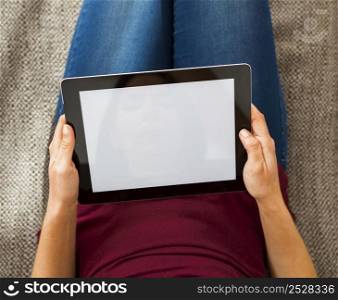 Cropped shot of female hands working with a tablet, tablet with copy space
