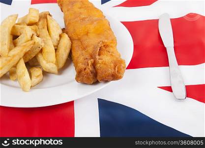 Cropped shot of junk food over British flag