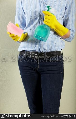 Cropped Shot Of Middle Aged Woman Holding Cleaning Products