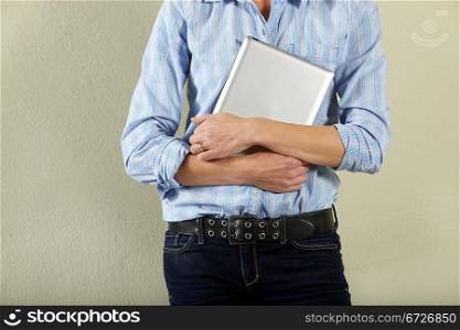 Cropped Shot Of Middle Aged Woman Holding Tablet Computer