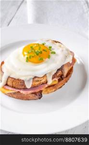 Croque madame hot sandwich made with ham, egg and cheese