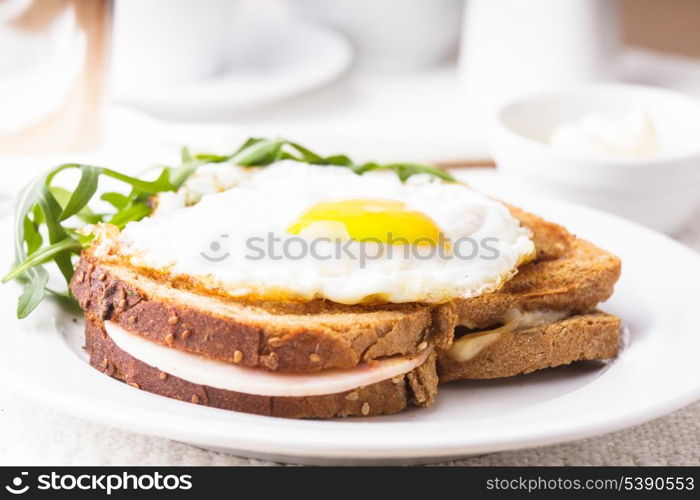 Croque Madame - sandwich with ham, cheese and fried egg