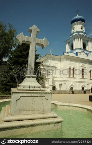 Cross - a fountain in orthodox laurels. Svyatogorsk laurels. Ukraine