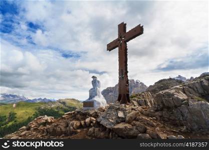 cross and Christ in Castellazzo mount, Rolle pass, Italy