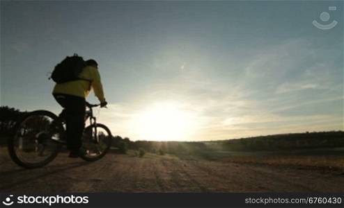 Cross-country cycling at sunrise
