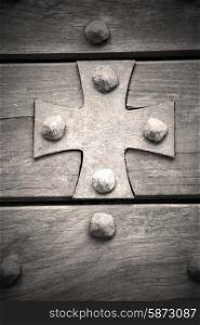 cross lombardy arsago seprio abstract rusty brass brown knocker in a door curch closed wood italy