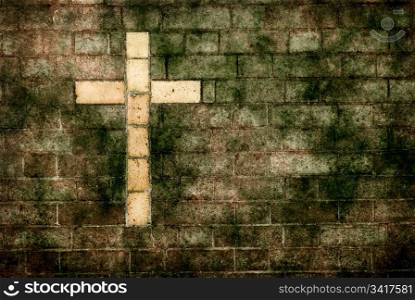 cross of christ built into a brick wall. grungy cross of christ built into a brick wall as background