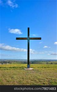 cross of christ in field on a perfect summers day