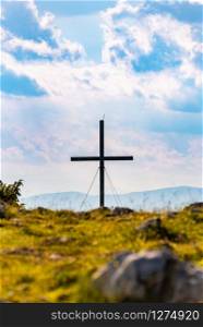 Cross on a peak of Austrian mountain Schockl in Styria Graz. Place for tourism and hiking recreation.. Cross on a peak of Austrian mountain Schockl in Styria Graz