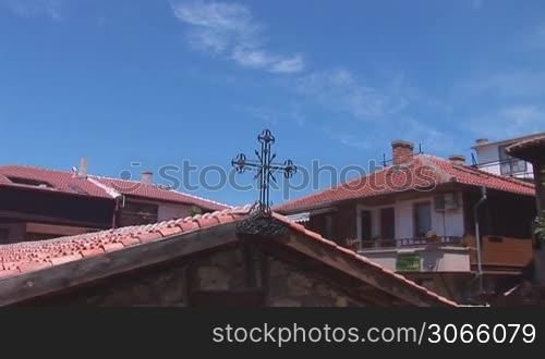 cross on the roof of the old church