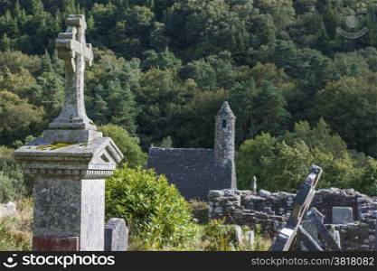 Cross on the tablet at Old Cemetery in Glendalough. Wicklow Mountains. Ireland