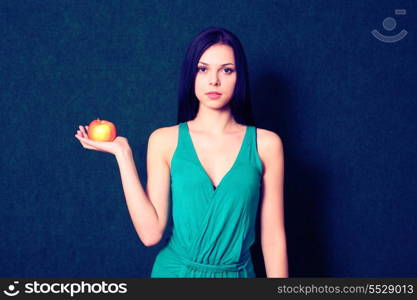 Cross processed image of young women with apple in hand