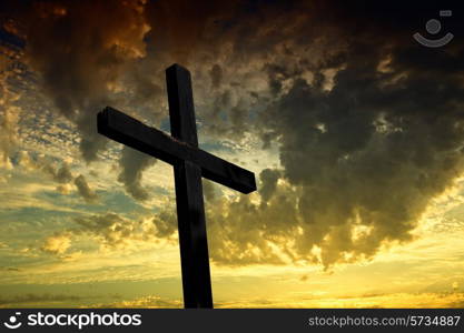 cross silhouette and the clouds at sunset