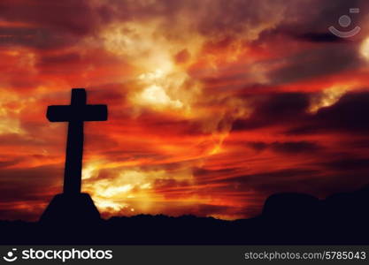 cross silhouette and the clouds at sunset