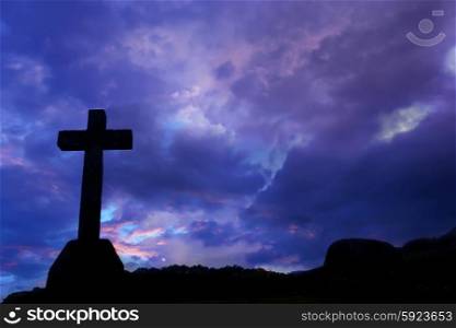 cross silhouette and the clouds at sunset