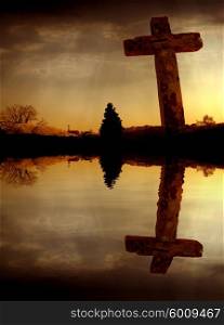 cross silhouette and the clouds at sunset