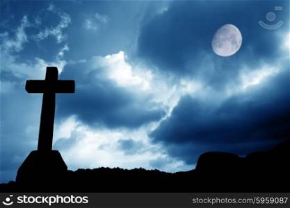 cross silhouette and the sky with full moon