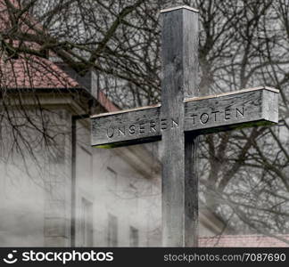 "Cross to commemorate the dead of the First World War in front of the castle in Fallersleben, German inscription says "For our dead""