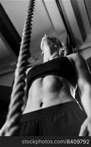 Cross training. Rope climbing exercise