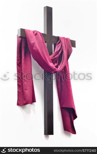 cross with red clothing on white background