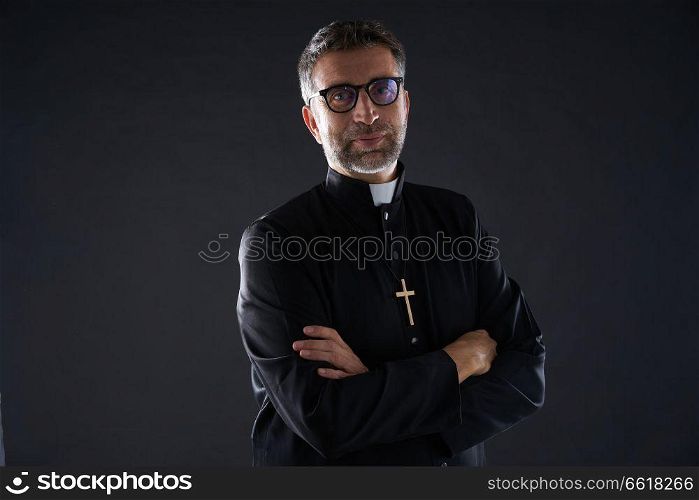 Crossed arms priest portrait senior male