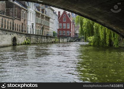 Crossing one of the bridges of the canals of Ghent. Belgium