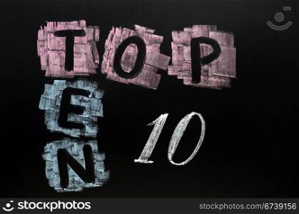 Crossword of Top Ten drawn in chalk on a blackboard