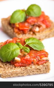 Crostini with tomato, garlic and basil. National italian dish