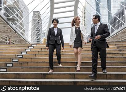 Crowd business people walking go to work in modern city life to working office. Crowd worker group of people busy life with businesswoman, man in urban street city lifestyle. Business People Concept.