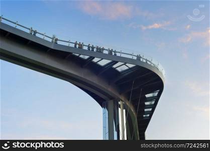 Crowd of people at new Pedestrian-Bicycle Bridge at sunset. New Klitschko Pedestrian-Bicycle Bridge one of the most interesting attractions of Kiev
