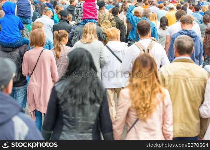 Crowd of people walking on the city street