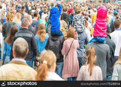 Crowd of people walking on the city street