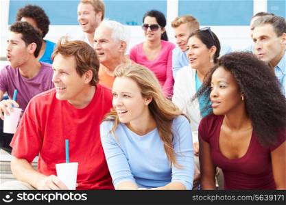 Crowd Of Spectators Watching Outdoor Sports Event