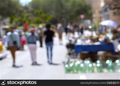 Crowded blurred street in European town. Blurred people background.