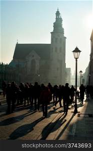 Crowded street and St. Andrew&rsquo;s Church in the sunshine day, Krakow