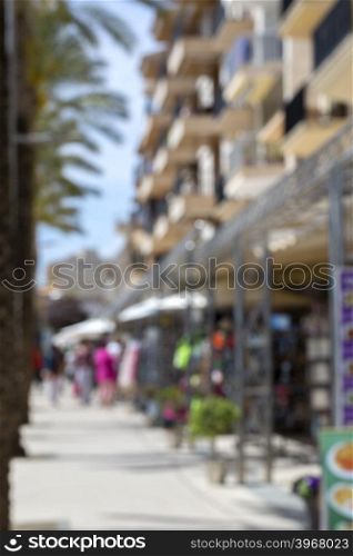 Crowded street in Spain, blurred background