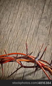 Crown of Thorns on wooden background