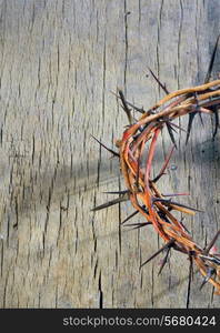 crown of thorns on wooden background