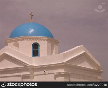 Crucifix on top of dome in Mykonos Greece